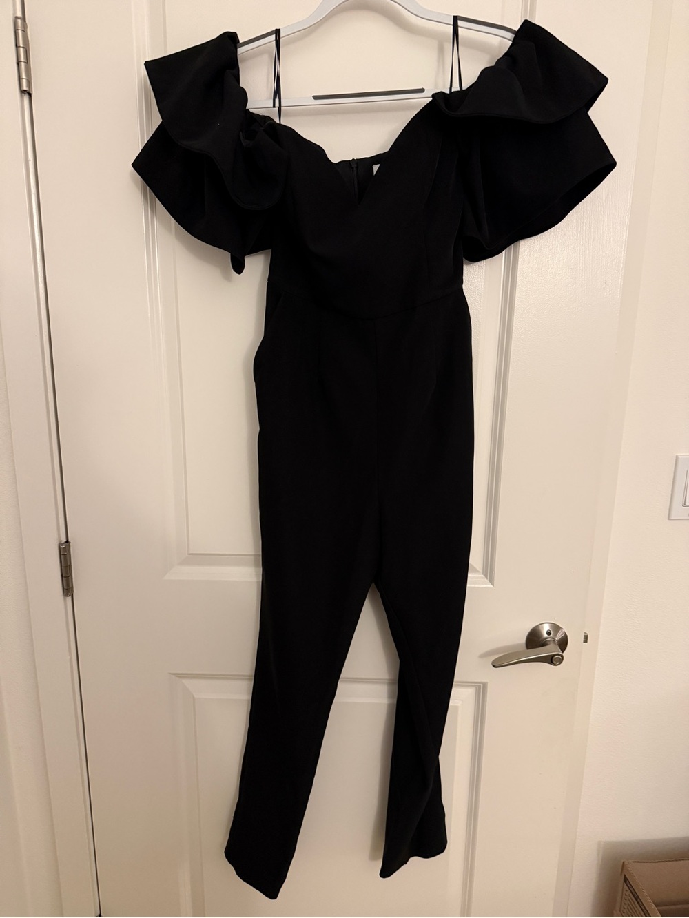 Elegant Black Off-Shoulder Jumpsuit with Statement Ruffle Sleeves